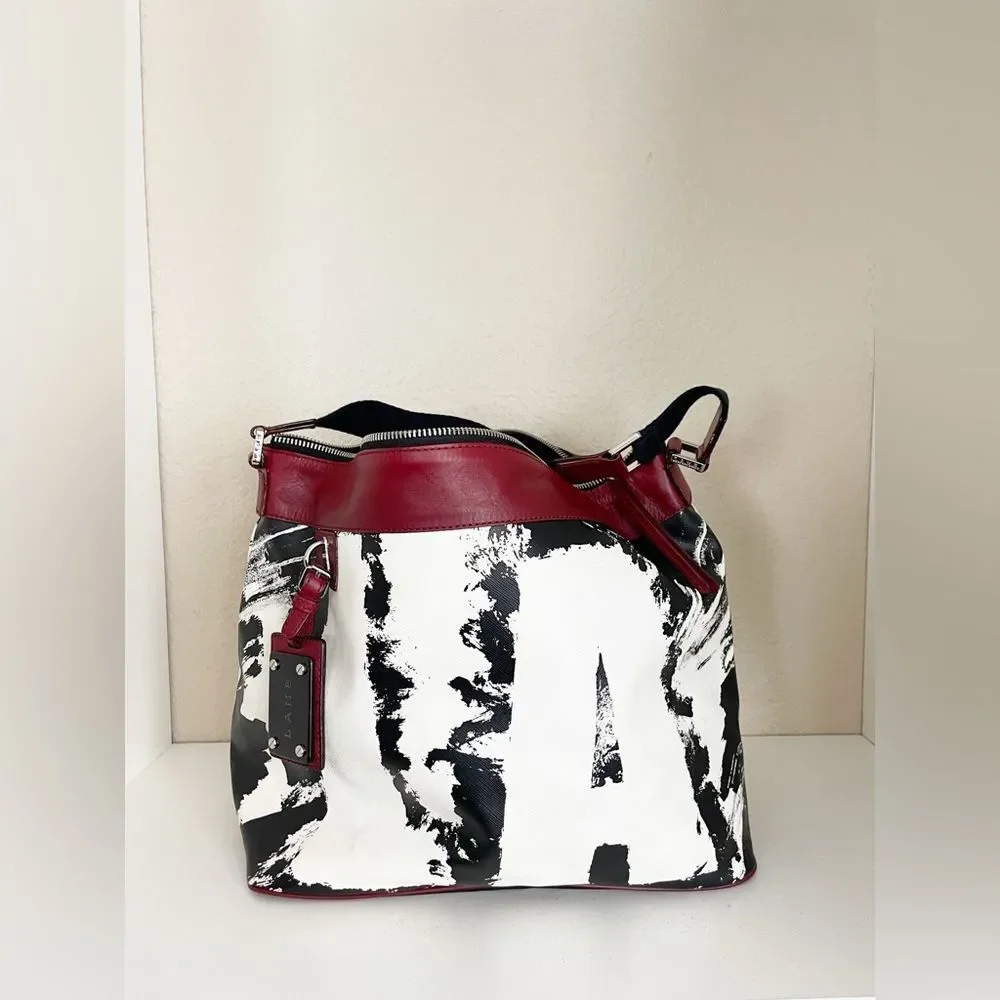 Rare L.A.M.B. Huntley hobo bag by Gwen Stefani, black, white graffiti red trim